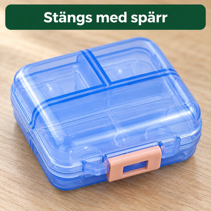 Närbild på den blå pillerasken med persikofärgad spärr, med texten stängs med spärr