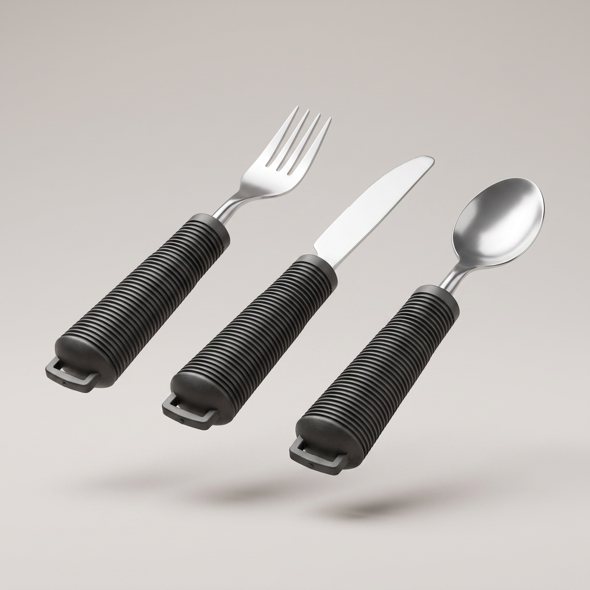 Greppvänliga bestick, gaffel kniv och sked med förtjockat handtag
